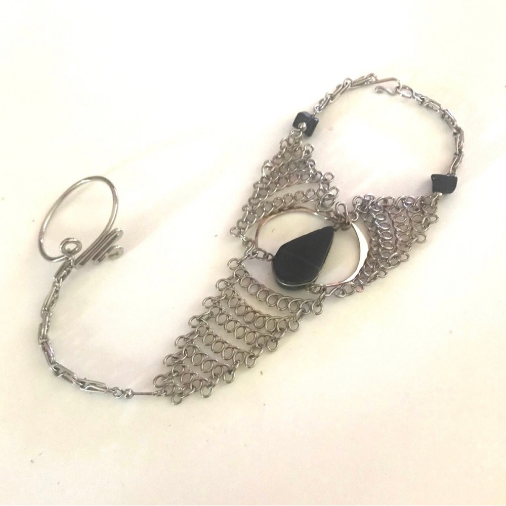 Peruvian silver bracelet with attached ring